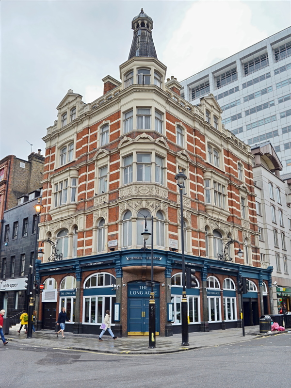 29 - The Long Acre, a well-known multi-story red-brick and stone-dressed corner pub located in central London
